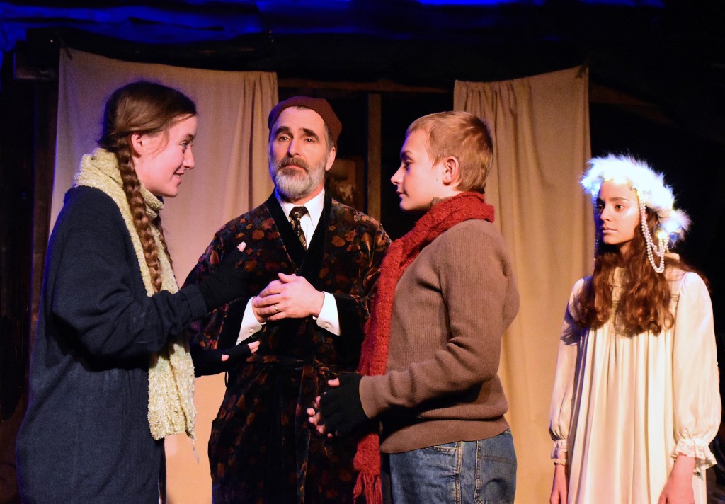 Evelyn Izdepski as Fan tells Shawn Hubbard as Young Ebenezer that he can come home, as David Whitehead (Scooge) and Talia Cutler (Ghost of Christmas Past) look on. Photo by Chip Gertzog.
