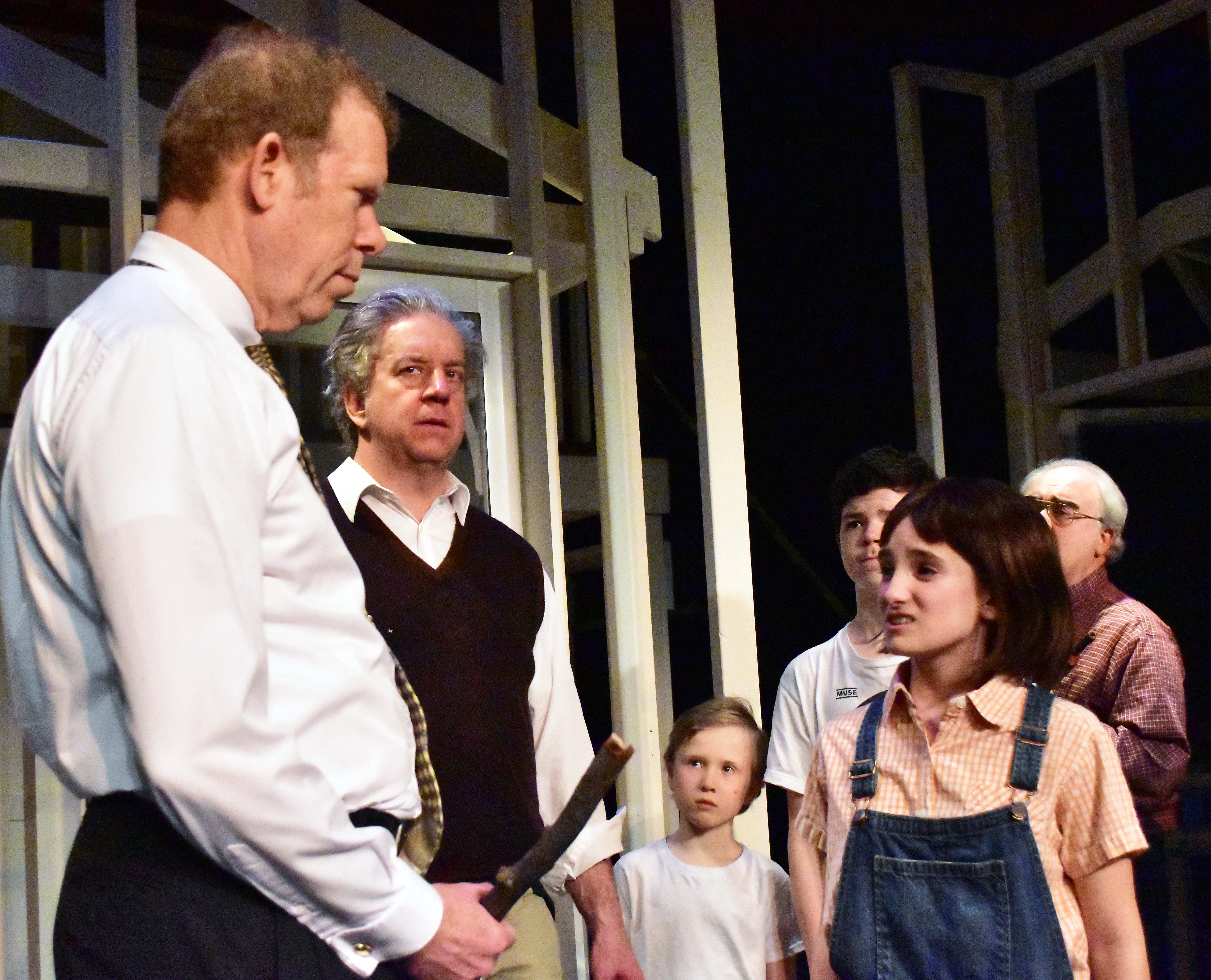 L to R: Harry Sullivan, Robert Heinly, Caden Mitchell, Brendan Dure, Sophia Manicone and Kevin Harnisch in a scene from the Providence Players production of To Kill a Mockingbird on stage from March 24th to April 8th at the James Lee Community Center Theater – Photo by Chip Gertzog, Providence Players